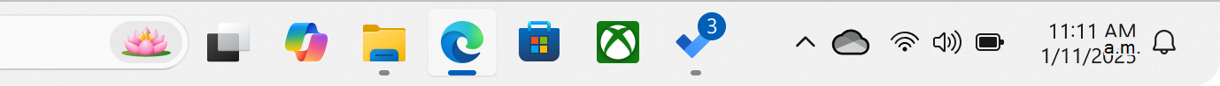 Captura de pantalla de la barra de tareas de Windows con una aplicación que muestra un distintivo.